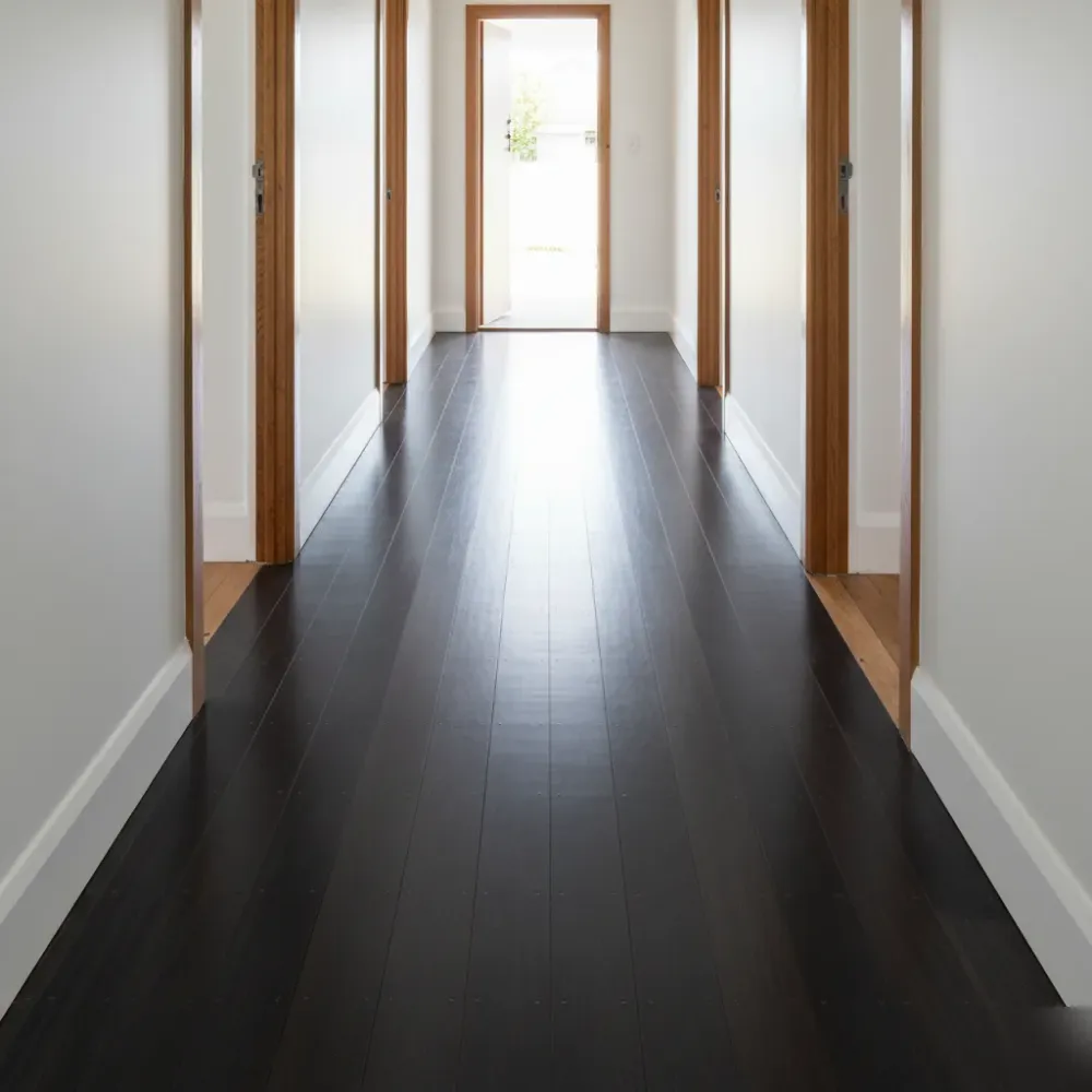 Finished floor staining result with seamless colour matching on Auckland timber hallway