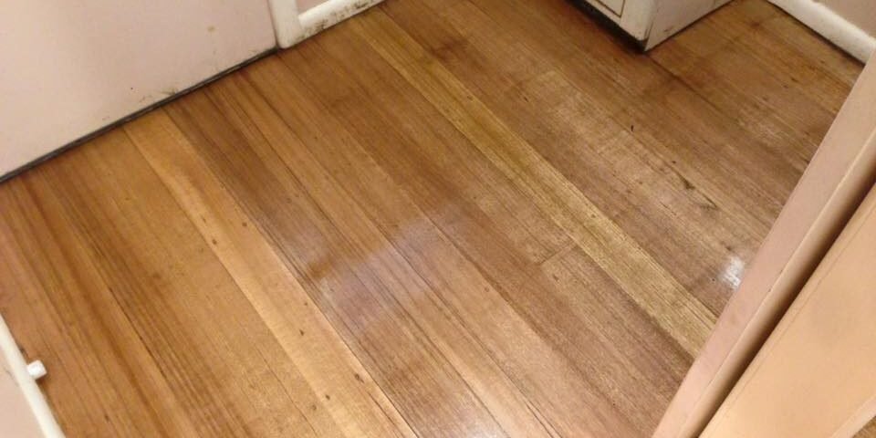 Timber floor being buffed before a fresh coat