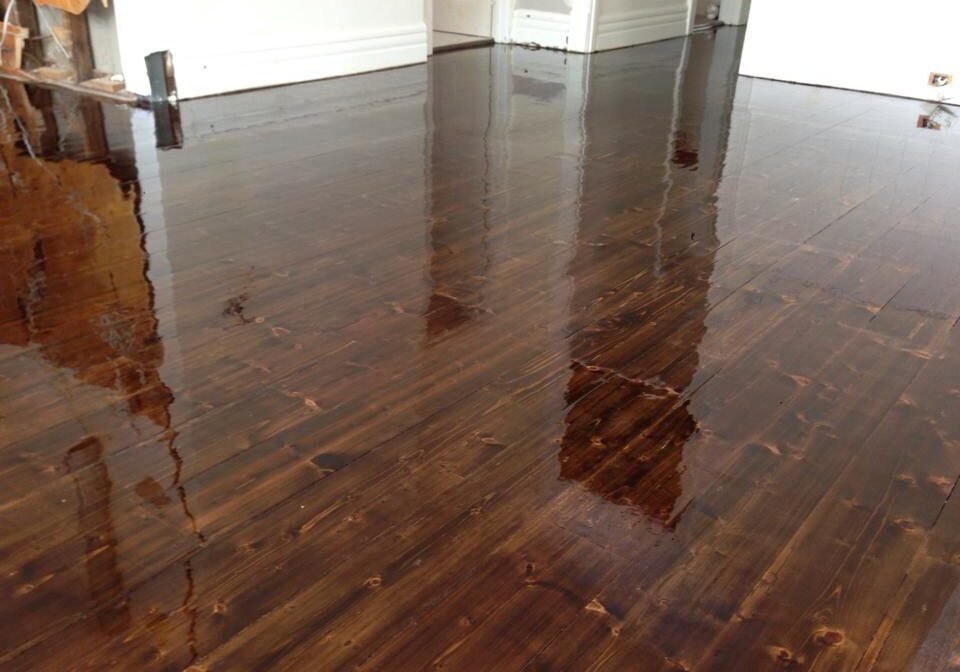 Glossy timber floor after sanding and three coats, Auckland